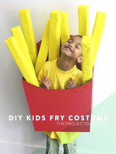 a young boy is dressed up as a costume with yellow sticks in the shape of toothpicks