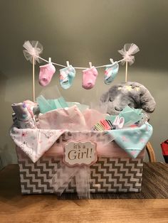 a gift basket filled with baby items on top of a table