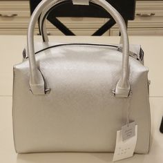 Silver Medium Size Bag. Spring Formal Satchel With Double Handle, Chic Satchel For Errands In Spring, Chic Satchel For Spring Errands, Formal Tote Satchel For Spring, Formal Spring Satchel Tote, Elegant Bags With Zipper Closure For Spring, Elegant Spring Bags With Zipper Closure, Elegant Satchel For Spring Errands, Chic Silver Bag For Spring