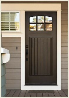 a brown front door on a house