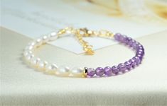 This bracelet is made of Natural Amethyst and Freshwater pearl, chakra healing yoga crystal. It is a tiny bracelet, an icon of minimalism. It give to us positive energy from Mother Nature and bring luck. It can be suitable casual, office and party dressing, very elegant and unique. The best gift ideal for our loved ones. Bracelet length: 15cm - 21 cm ( Options) Bracelet width/ bead size:  Stone bead:  4mm, Pearl bead: ~ 4x6mm Material: Natural/untreated Amethyst beads, freshwater pearl, Steel silver/gold plated clasp and chain Handmade with Love NOTED: There are parts of jewelry that are made from silver-plated or gold-plated metals, so they can easily tarnish if constantly wet or exposed to cleaning chemicals. If tarnishing occurs, you can scrub them with a silver cloth like real silver j Purple Minimalist Handmade Bracelet, Minimalist Handmade Purple Bracelets, Handmade Minimalist Purple Bracelets, Handmade Minimalist Purple Bracelet, Tiny Bracelet, Pearl And Amethyst, Healing Yoga, Party Kleidung, Les Chakras