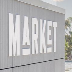 a sign that says market on the side of a building