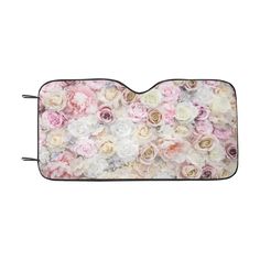 a car mat with pink and white flowers on the front, along with black handles