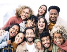 a group of people are smiling and posing for the camera with their arms around each other