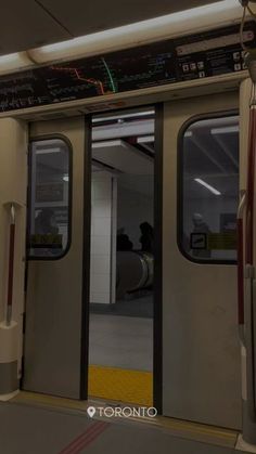 an empty subway car with the doors open to let passengers in and out on the train