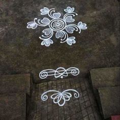 some white chalk drawings on the ground