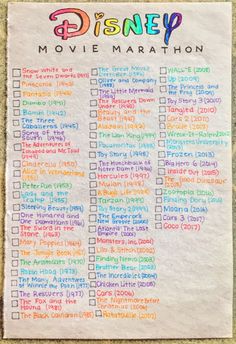 the disney movie marathon checklist is shown on a piece of paper with colorful writing