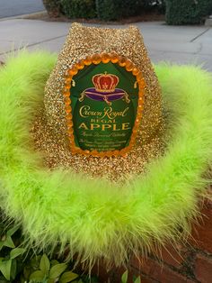 Gold glitter, black based hat, like green boa, and Crown Apple logo Crown Royal Hats, Crown Apple Cowboy Hat, Liquor Themed Cowboy Hats Diy, Liquor Halloween Costumes, Crown Apple, Teenage Halloween Costumes