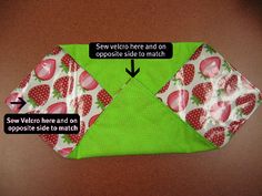 an origami envelope made out of fabric with strawberrys and polka dots on it