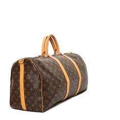 Sac Keepall 50 Vintage en toile monogram marron. Intérieur en Tissu Marron. Accastillage en métal Doré. En Très Bonne Condition : Quelques signes d'usure sur le cuir, Légère usure aux anses, Rayures sur le hardware Code série : FL1022 Dimensions Largeur: 50cm, Hauteur: 29cm, Profondeur: 23cm, Bandoulière: 110cm Accessoires Dustbag d'origine, Certificat de conformité Vintega, Bandoulière (Amovible et réglable) SKU AY598-308-109 Chic Me, Exclusive Bag, Beautiful Packaging, New Bag, You Bag, Fashion Statement, Sleek Design, Fashion Forward, Bags Designer