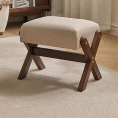 a foot stool sitting on top of a carpeted floor