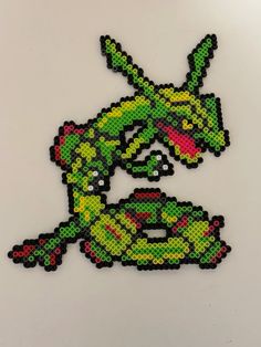 the pixel art is made out of different colors and shapes, including an image of a lizard