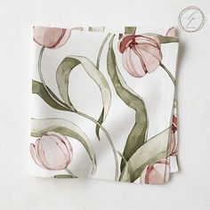 two napkins with pink flowers on them