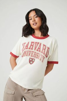 Harvard University Graphic Ringer Tee College Varsity T-shirt With Graphic Print, Casual Short Sleeve T-shirt With University Logo, College Style Short Sleeve T-shirt For Game Day, Retro T-shirt With Letter Print For College, Crew Neck Slogan T-shirt For College, Sporty University Logo T-shirt With Crew Neck, Casual Cotton T-shirt With University Logo, Collegiate Cotton T-shirt With Slogan, College Fan Apparel T-shirt With Slogan