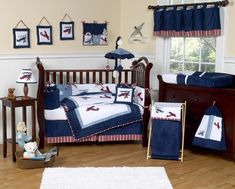 a baby crib bedding set with airplanes on it