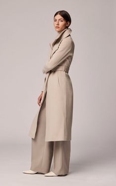 Chic Wool Coat With Belted Cuffs And Lapel Collar, Solid Wool Coat For Work, Chic Wool Coat With Belted Cuffs And Notch Lapel, Structured Beige Business Outerwear, Chic Collared Office Outerwear, Chic Tailored Outerwear With Belted Cuffs, Modern Belted Wool Coat For Work, Chic Wool Coat With Belted Cuffs For Office, Structured Modern Outerwear For Work