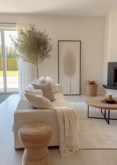 a living room filled with furniture and a flat screen tv