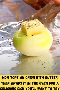 someone is peeling an onion with butter and then wraps it in the oven for a delicious dish you'll want to try