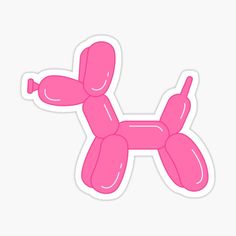 a pink balloon dog sticker sitting on top of a table