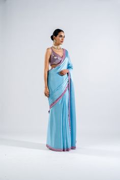 Satin chiffon mirror work border saree paired with sequins embellished blouse.From Vvani Vats Chahak's collection.DELIVERY TIMEPlease allow 8-12 weeks for your outfit to arrive..FABRIC DETAILSBlouse - Georgette, Saree - Satin ChiffonProfessional cleaning only. Designer Blue Pre-draped Saree With Mirror Work, Silk Pre-draped Saree With Mirror Work For Party, Blue Sequined Pre-draped Saree, Blue Party Wear Saree With Zari Work, Blue Zari Work Pre-draped Party Saree, Blue Georgette Blouse Piece For Party Wear, Blue Pre-draped Saree With Dupatta For Party, Blue Pre-draped Saree With Mirror Work For Party Wear, Blue Pre-draped Saree For Festive Party Wear