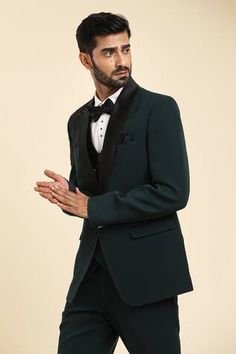 Green tuxedo elevated with placement abstract, cutdana, beads embroidery. Paired with an inner waistcoat, shirt and trouser. Comes along with a bow tie. - Aza Fashions Designer Festive Tuxedo For Reception, Elegant Tailored Bandhgala For Reception, Elegant Fitted Tuxedo For Reception, Fitted Tuxedo Set For Reception, Elegant Fitted Tuxedo For Festive Occasions, Designer Tuxedo For Reception, Elegant Fitted Suit For Reception, Designer Festive Tuxedo For Ceremony, Tailored Tuxedo For Festive Occasions