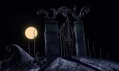 a full moon is in the sky above some tombstones