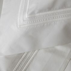 closeup of white sheets and pillow cases