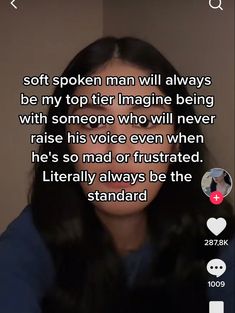 a woman with long black hair is looking at the camera and has an interesting message on her face