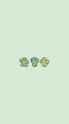 three little green teddy bears sitting next to each other on a light blue wallpaper