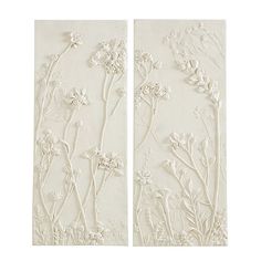 two white wall panels with flowers on them