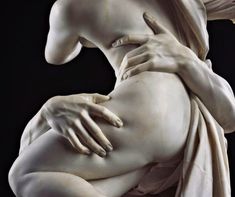 a woman's torso is covered in white marble