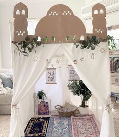 a bed with a canopy and rugs on the floor