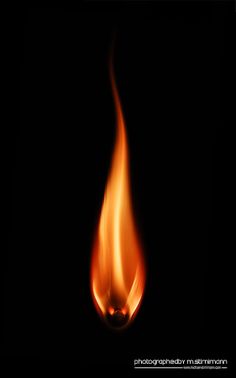 an orange flame on a black background