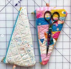 two pieces of fabric with scissors on them next to a quilted piece of cloth