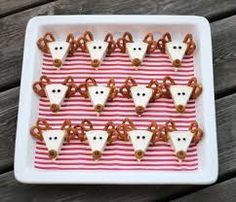 some pretzels are arranged in the shape of mice on a striped tray with red and white stripes