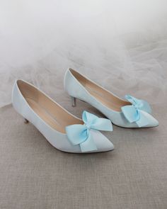 "Pointy toe pump with low heels and added satin bow creates a simple and sweet style for your special occasion. Easy slip on with comfort or bride and wedding party. DETAILS: HEEL HEIGHT: 2.25 inches COLORS AVAILABLE: White, Champagne, Light Blue, Soft Blush, Ivory, Navy, Burgundy UPPER: Synthetic upper and lining MATERIALS: Mandmade outsole Not sure of which size to purchase? Shoes measurements are as follow: (Please note measurements taken the length of inside of shoe from toe to heel) Size 6 Blue Low Heels, Bridesmaids Shoes, Women's Slip Ons, White Champagne, Bridesmaid Shoes, Party Details, Satin Heels, Womens Wedding Shoes, Blue Soft