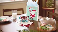 a table topped with cookies and a bag filled with santa clause on top of it