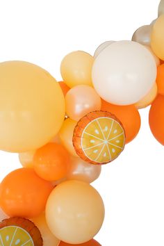 an orange and lemon themed balloon arch