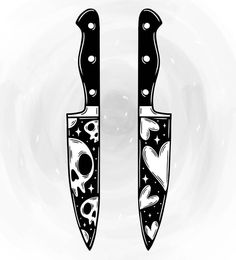 two black and white knives with skulls on them