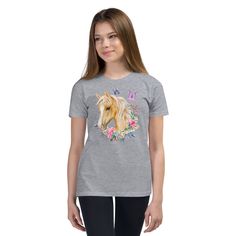 Our charming Youth T-Shirt adorned with a breathtaking Palomino horse, delicate floral motifs, and enchanting butterfly design. This fashion-forward tee will make your little one feel as graceful as a butterfly and as elegant as a Palomino horse. The soft and breathable fabric ensures maximum comfort, while the vibrant colors and intricate details bring this unique masterpiece to life. Whether your young adventurer wears it casually or dresses it up, this T-shirt is a delightful addition to any Animals And Nature, Cute Donkey, Palomino Horse, Vibrant Flowers, Flowers Design, Vibrant Flower, Floral Motifs, A Butterfly, Butterfly Design