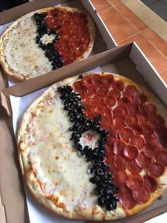 two pizzas with black olives, pepperoni and pepperoni are in boxes