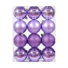 purple christmas ornaments in a clear box