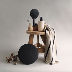 a wooden table topped with black and white items