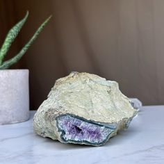 This deep purple amethyst geode cave has the highest quality of the semi precious stones. This geode has beautiful large crystals and agate bands. Combine design and wellness by adding an amethyst geode to the decoration of your spaces.Its vibrant deep purple color is characteristic of the geodes extracted from URUGUAY, one of the few places in the world where you can find. YOU WILL RECEIVE THE PIECE OF THE PICTURE!! ✧ MEASURES:Height: 2.5 in. x Width: 4 in. Weight 1.6 lb (765 gr). Lavender Amethyst Geodes For Spiritual Use, Large Spiritual Geodes For Healing, Purple Geodes With Natural Stones, Unique Purple Geodes With Natural Stones, Unique Purple Natural Stone Geodes, Healing Purple Geodes With Natural Stones, Unique Raw Stone Geodes For Healing, Unique Healing Raw Stone Geodes, Purple Amethyst Geodes With Natural Stones