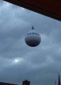 a water tower with the word sebel on it in front of some dark clouds