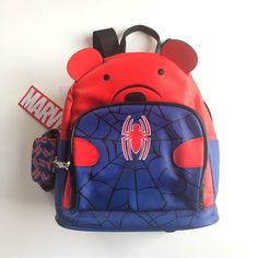 Brand New With Tag. Spiderman Pu Mini Backpack The Backpack Features One Main Compartment And One Front Accessory Pocket With Zipper Closures For Organization. It Also Includes A Bonus Detachable Air Pod Case. The Backpack Has Padded And Adjustable Shoulder Straps, A Top Locker Loop Handle. This Backpack Will Be Perfect For Both School Day Or A Day Out. One Main Compartment Front Accessory Zip Pocket Bonus Detachable Air Pod Case Adjustable Padded Shoulder Straps 10 Inches H X 8 Inches W X 4.5 I Spiderman Mini Backpack, Back To School Mobile Phone Bag, Red Travel Satchel, Red Shoulder Satchel Bag, Leather School Backpack With Mobile Phone Bag, Red Portable Bag For Daily Use, Casual Red Portable Bag, Red Backpack For Travel And Back To School, Red Travel Backpack For Back To School