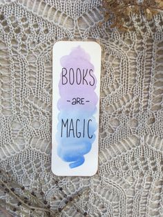 a bookmark with the words books are magic written on it