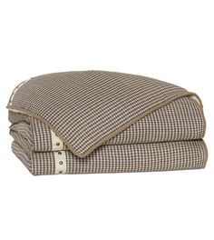 the brown and white checkered sheets are folded on top of each other