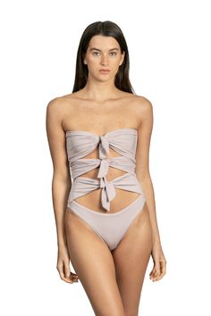 Santa Cruz by Sanlier is a one-piece that features multiple ties in the front for a playful, unique look. Plus, the strapless design adds an alluring element to this otherwise innocent piece. It’s equally subtle and sexy while offering plenty of support. Chic Strapless Tube Top For Poolside, Chic Strapless Swimwear For Evening, Elegant Bandeau Swimwear For Spring, Elegant Bandeau Party Swimwear, Elegant Strapless Swimwear For Spring, Chic Strapless Party Swimwear, Elegant Strapless Swimwear For Party, Elegant Strapless Swimwear For Evening, Elegant Strapless Evening Swimwear