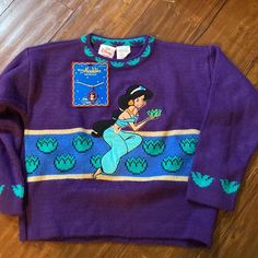 Vintage The Disney Store Princess Jasmine From Aladdin Sweater Sweater Material With Appliqu Of Jasmine Embroidered On Front And Sleeve Detail! Excellent Gently Used Condition With Very Mild Piling. Vibrant Purple Color. A Great Rare Find! Also A Razzazzles Aladdin Jasmine Necklace By Applause To Wear With It! Complete This 90s Look With Another Original! New In Package Condition Collectible! Jasmine Necklace, Jasmine From Aladdin, Mickey Mouse Jacket, Minnie Mouse Sweater, Aladdin Jasmine, Baby Robes, Disney With A Toddler, Disney Toddler, Hooded Cardigan Sweater